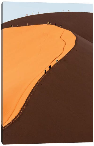 Africa, Namib Desert. Hikers climbing the red sand dune in Namibia. Canvas Art Print
