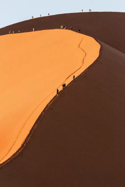 Namibia: Africa, Namib Desert. Hikers climbing the red sand dune in Namibia. by Deborah Winchester