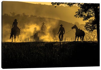 USA, California, Parkfield, V6 Ranch silhouette of riders, on horseback. Early dusty morning.  Canvas Art Print - Cowboy & Cowgirl Art