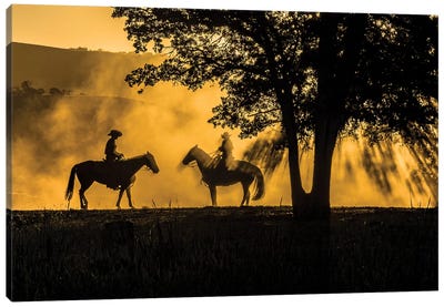 USA, California, Parkfield, V6 Ranch silhouette of two riders on horseback. Early dusty morning.  Canvas Art Print - Cowboy & Cowgirl Art