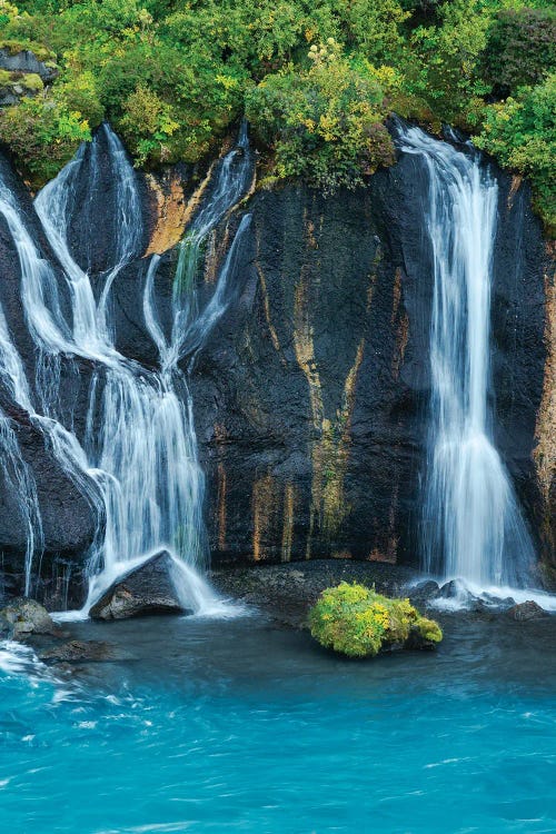 Iceland, Hraunfossar. Tiny cascades emerge from the lava to flow into the Hvita River over a half mile stretch.