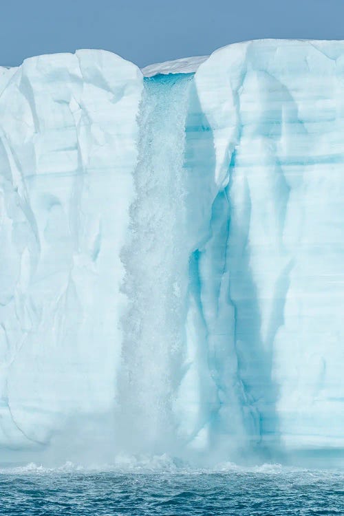 Arctic, Svalbard, Nordaustlandet Island. Waterfalls cascading from the melting glacier.