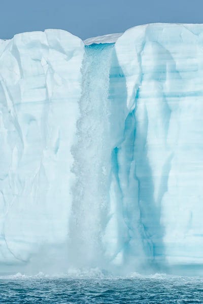 Arctic, Svalbard, Nordaustlandet Island. Waterfalls cascading from the melting glacier.