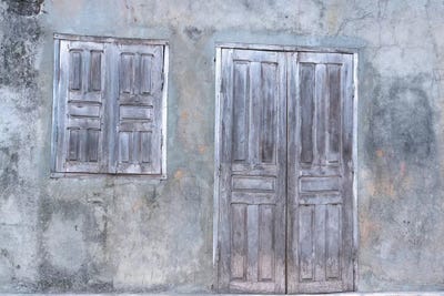 Africa, Madagascar, Fort Dauphin, Tolanaro Marketplace. A Shuttered Home Showing The Muted Colors Of Weathered Wood. by Ellen Goff framed canvas print