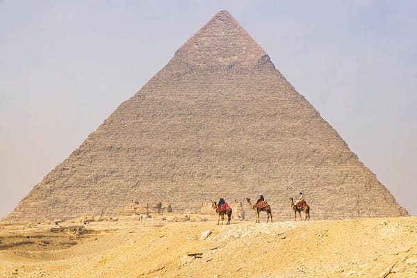 Giza: Giza, Cairo, Egypt. Men On Camels At The Great Pyramid Complex. by Emily M Wilson