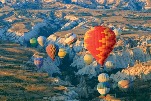 Emily Wilson: Turkey, Anatolia, Cappadocia, Goreme. Hot air balloons above Red Valley II by Emily Wilson