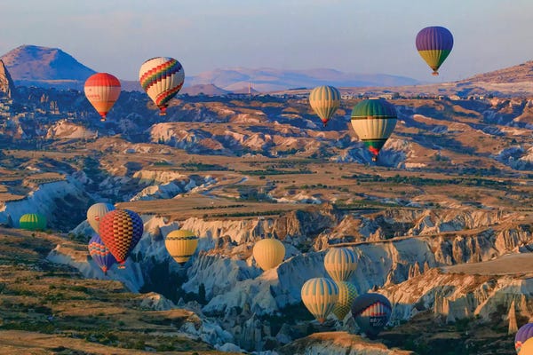 Turkey, Anatolia, Cappadocia, Goreme. Hot air balloons flying above the valley II