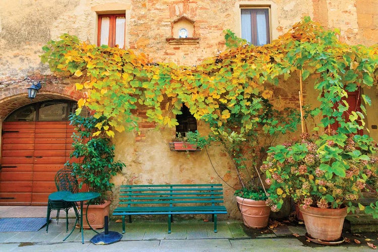 Italy, Tuscany, province of Siena, Chiusure. Hill town. Fall colors and park bench.