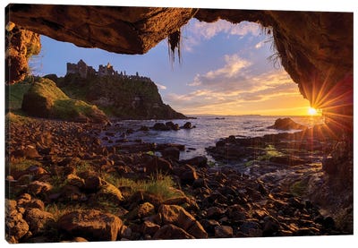 Cave Frames Sunset At Dunluce Castle, Causeway Coast, County Antrim, Northern Ireland Canvas Art Print - Northern Ireland