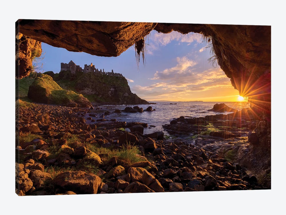 Cave Frames Sunset At Dunluce Castle, Causeway Coast, County Antrim, Northern Ireland by Gareth McCormack 1-piece Canvas Print