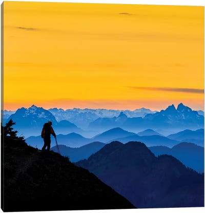 USA, Washington State. A backpacker descending from the Skyline Divide at sunset. Canvas Art Print - Adventure Seeker