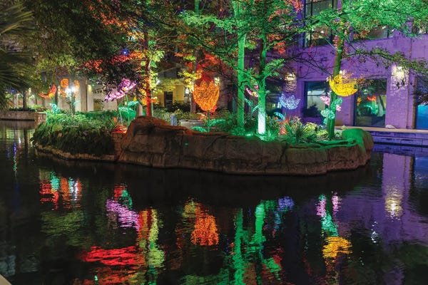 Canvas Print: Flower Sculptures Lit Up At Night, Riverwalk, San Antonio, Texas by George Oze