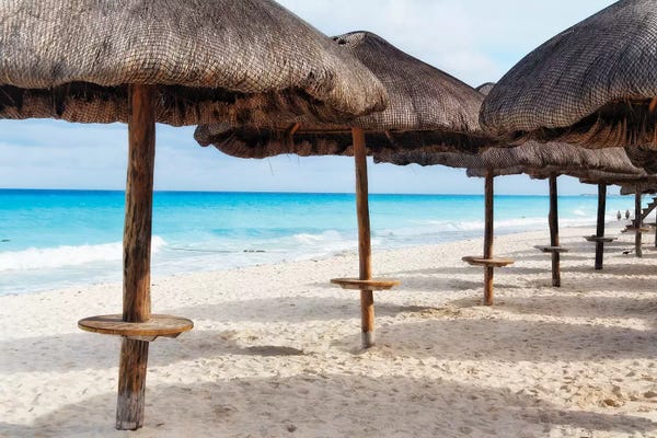 George Oze: Palapas Lined up on the Beach, Cancun, Mexico by George Oze