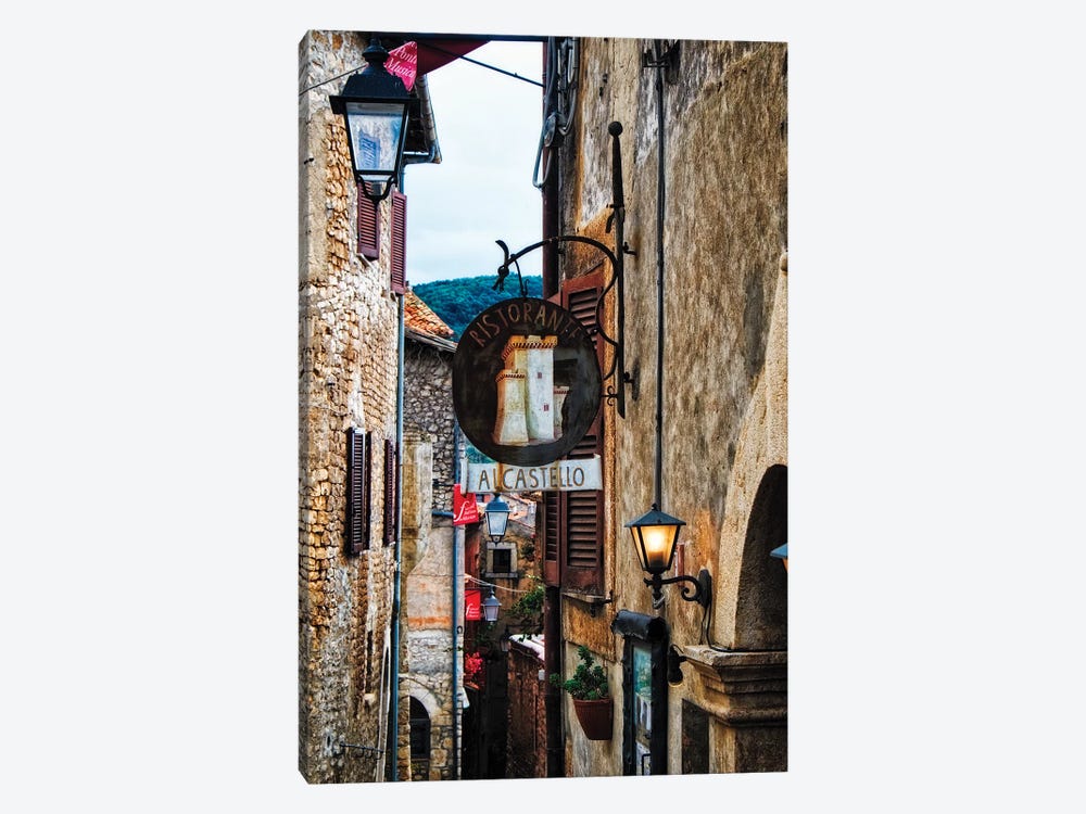Narrow Medieval Street With Signs And Lamps, Sermoneta, Italy by George Oze 1-piece Canvas Wall Art