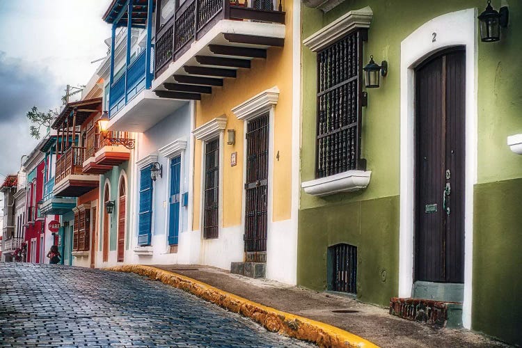 Low Angle View Of Colorful Houses On A Cobblestone Street