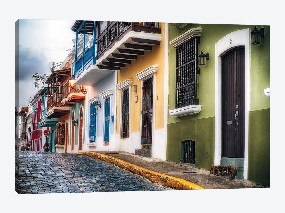 Low Angle View Of Colorful Houses On A Cobblestone Street by George Oze 1-piece Canvas Print
