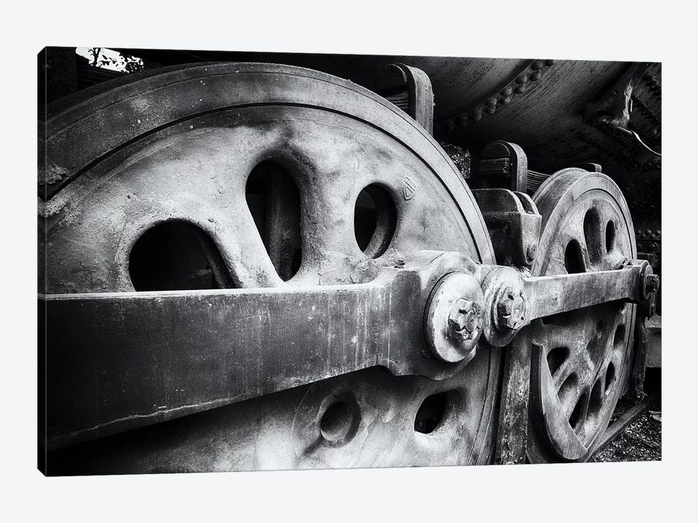 Close Up View Of Wheels Of A Steel Locomotive by George Oze 1-piece Canvas Art Print