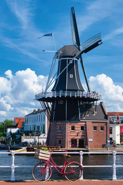 Netherlands: Bicycle And A Windmill, Haarlem, The Netherlands by George Oze