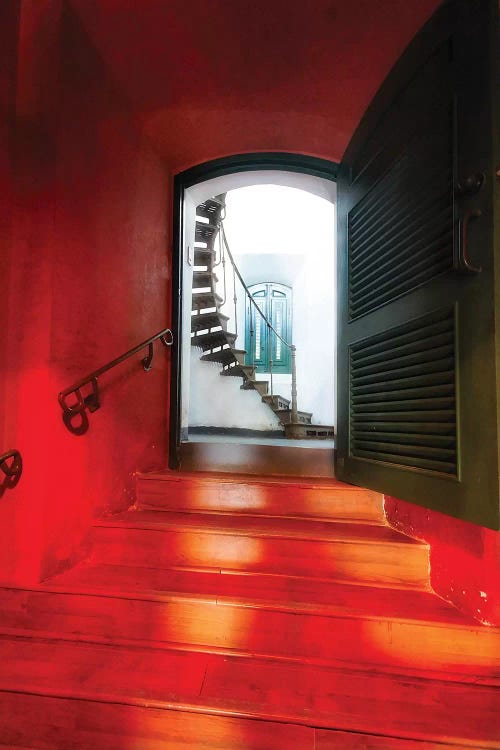 Red Doorway To A Spiral Staircase