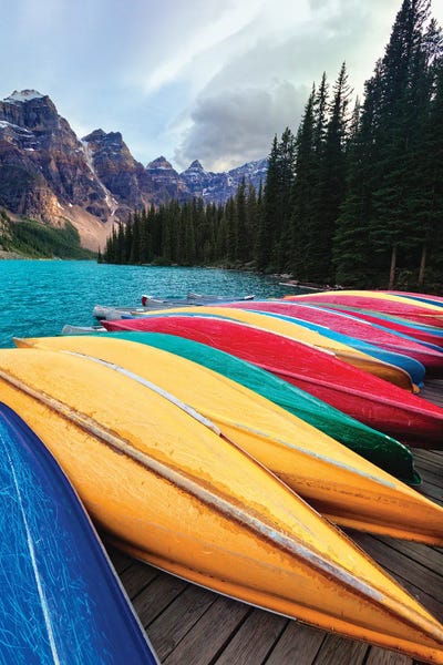 Canoes On A Dock, Moraine Lake, Banff National Park, Alberta, Canada by George Oze gallery poster