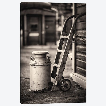 Old Milk Can With A Hand Barrows At A Train Station Canvas Print #GOZ506} by George Oze Canvas Art Print