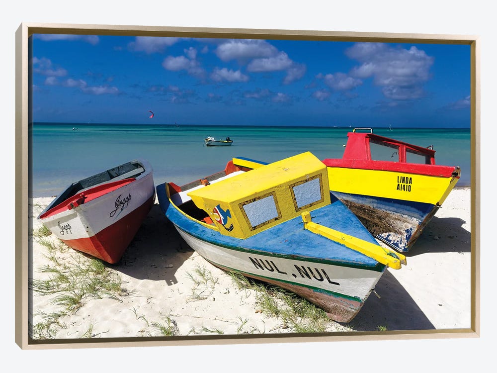 Image of Three multicolored plastic fishing boats anchored
