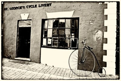 Old Bicycle On Display, St. George, Bermuda by George Oze framed canvas print