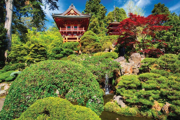 Traditional Japanese Pavilions In A Garden With A Small Waterfall