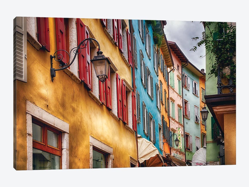 Low Angle View Of Colorful House Facades, Riva Del Garda, Lombardy, Italy by George Oze 1-piece Canvas Art Print