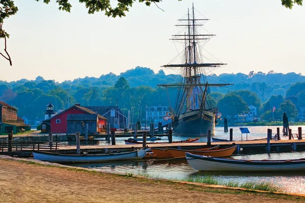 Canoes: Scenic View Of The Historic Mystic Seaport With The Joseph Conrad Tall Ship, Connecticut by George Oze