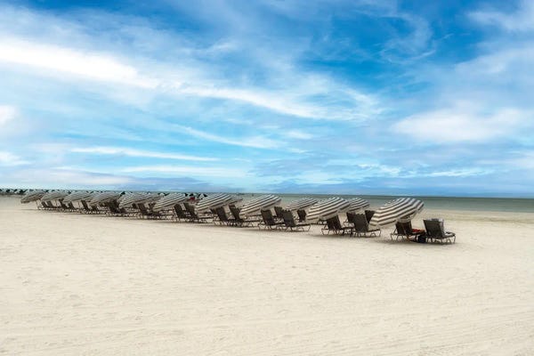 Cowboys & Cowgirls: Row Of Parasols And Lounge Chairs, Marco Island, Florida by George Oze