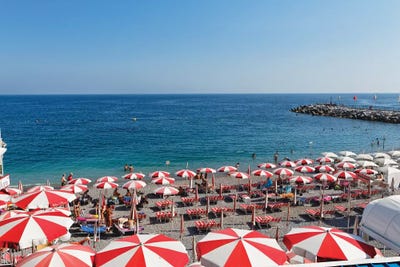 High Angle View of a Beach with Rows of Beach Umbrellas and chairs, Amalfi, Campania, Italy by George Oze framed wall art