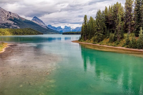 Emerald Green Maligne Lake With The Rocky Mountains, Alberta, Canada