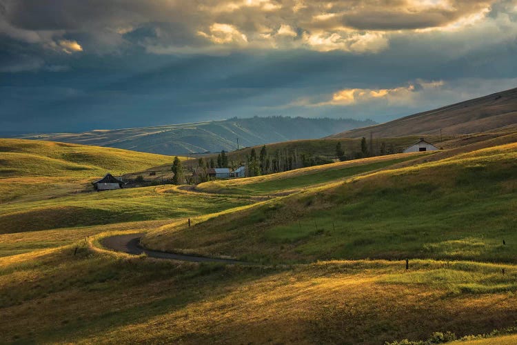 Ranch nestled in the rolling hills near Painted Hills, Oregon at sunset