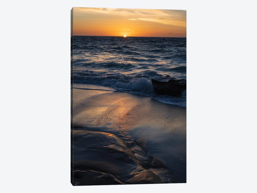 Sun setting on the Pacific Ocean with reflection of golden in the sand by Sheila Haddad 1-piece Canvas Print