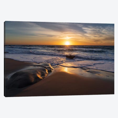 Sunset reflecting off the water on the sand of a beach Canvas Print #HDD17} by Sheila Haddad Canvas Print