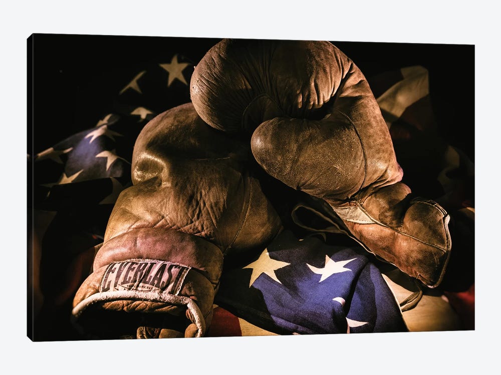 Pair of vintage boxing gloves laying on a flag carefully painted with light by Sheila Haddad 1-piece Canvas Art