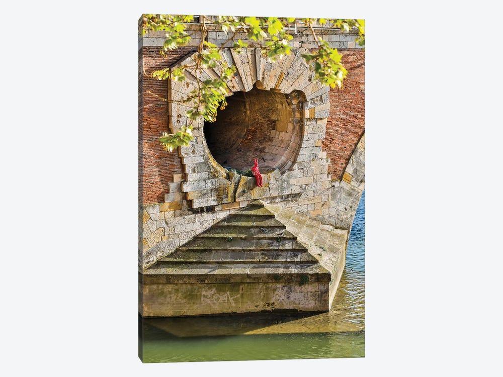 France, Toulouse. Red Devil sitting in opening of the Pont Neuf (Bridge) by Hollice Looney 1-piece Canvas Print