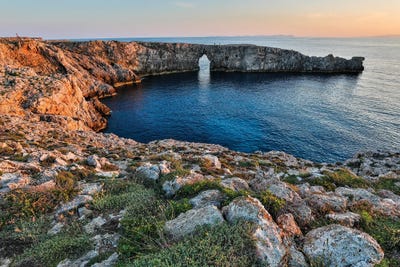 Sunset At Pont d'en Gil (Natural Sea Arch), Menorca, Spain by Hollice Looney framed canvas print