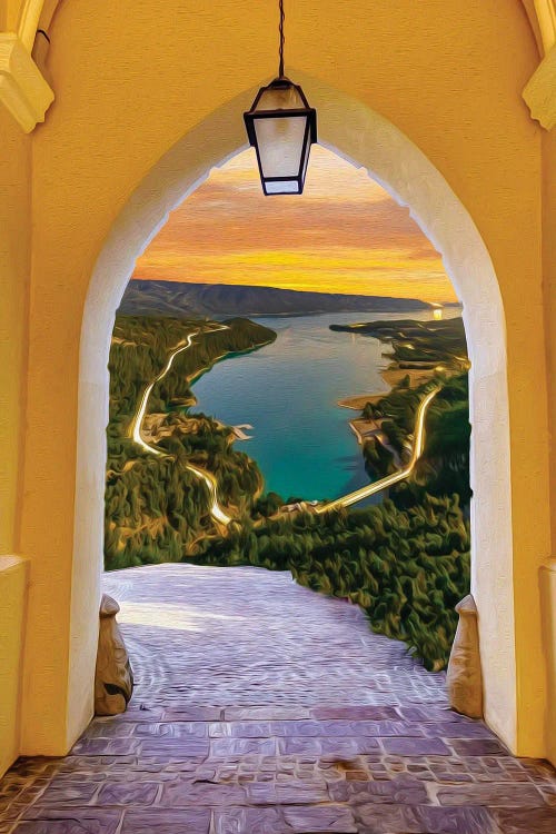 A View Of The Mountain Lake From A Large Stone Arch