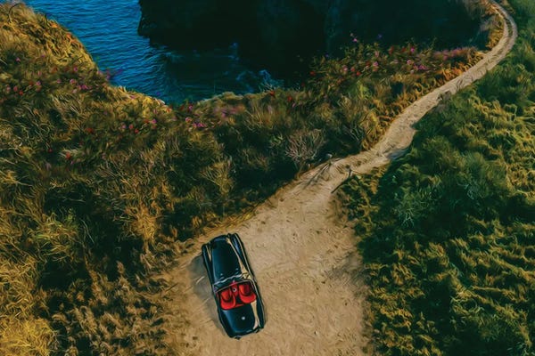 Ievgeniia Bidiuk: A Convertible On A Rocky Beach By The Sea by Ievgeniia Bidiuk