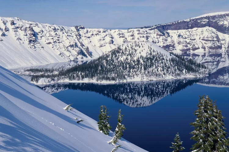 USA, Oregon, Crater Lake National Park. Winter snow on west rim of Crater Lake and Wizard Island.