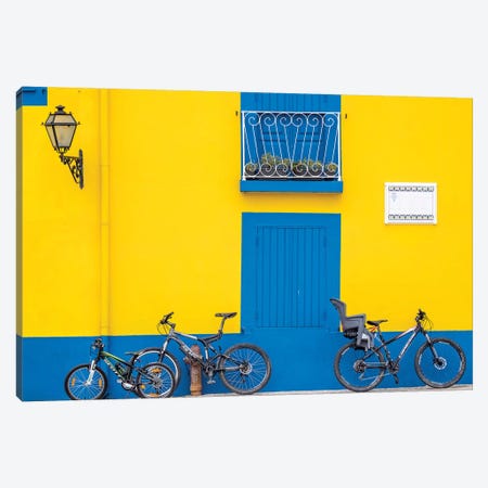 Portugal, Aveiro. Yellow house with blue shutters, windows and doors in the city of Aveiro. Canvas Print #JEG13} by Julie Eggers Canvas Wall Art