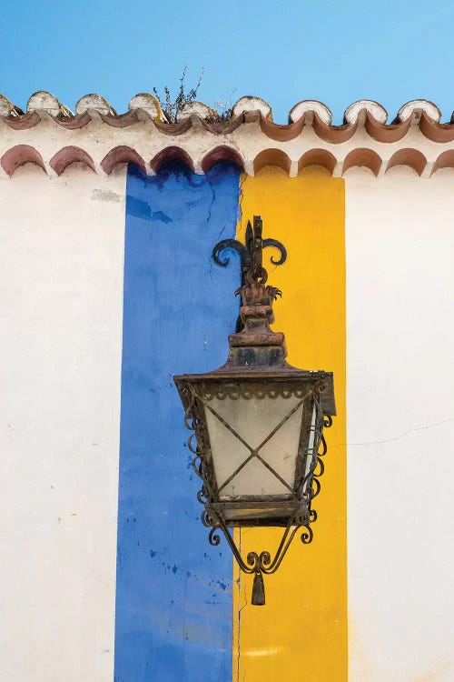 Wrought Iron Lantern Hanging From A Colorful Stripped Wall, Obidos, Portugal