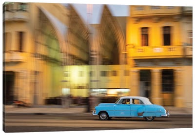 Cuba, Havana, classic car in motion at dusk on Malecon. Canvas Art Print