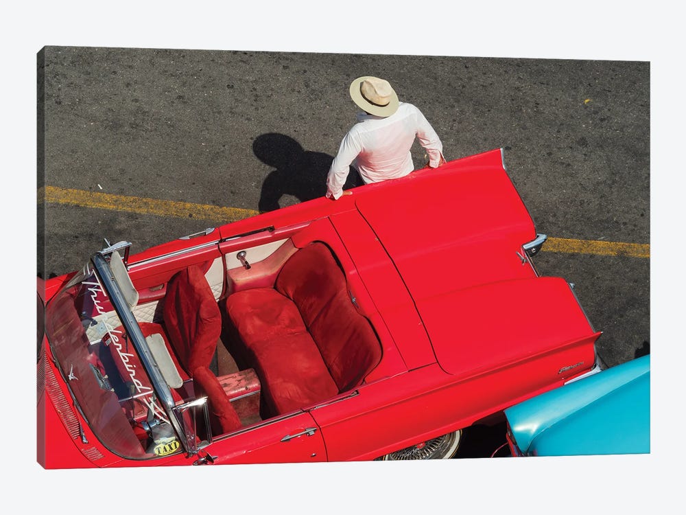 Cuba, Havana, Havana Vieja (Old Havana), red classic convertible and driver, viewed from above. by Merrill Images 1-piece Canvas Print