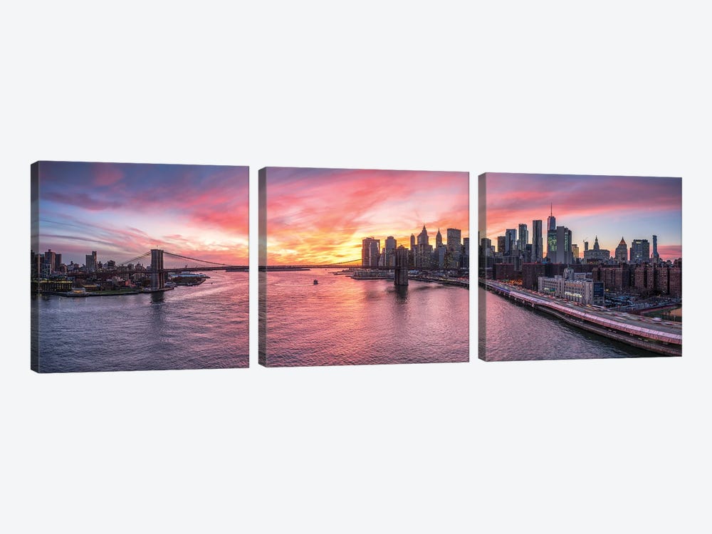 Panoramic View Of The Manhattan Skyline And Brooklyn Bridge At Sunset by Jan Becke 3-piece Canvas Art Print