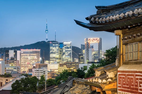South Korea: Historic Bukchon Hanok Village In Seoul With View Of The N Seoul Tower And Namsan Mountain by Jan Becke