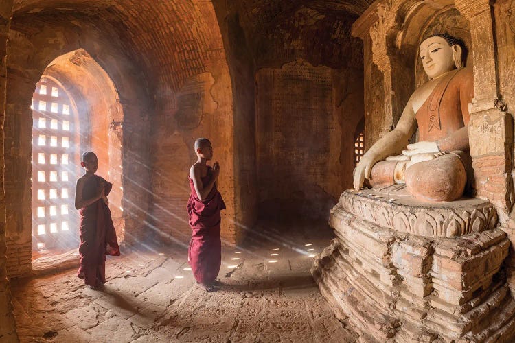 Two Young Novice Monks Praying To Buddha In An Old Temple In Bagan, Myanmar