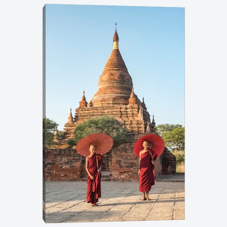Two Young Novice Monks With Red Umbrellas Standing In Front Of A Temple, Bagan, Myanmar Canvas Print #JNB1147} by Jan Becke Canvas Wall Art